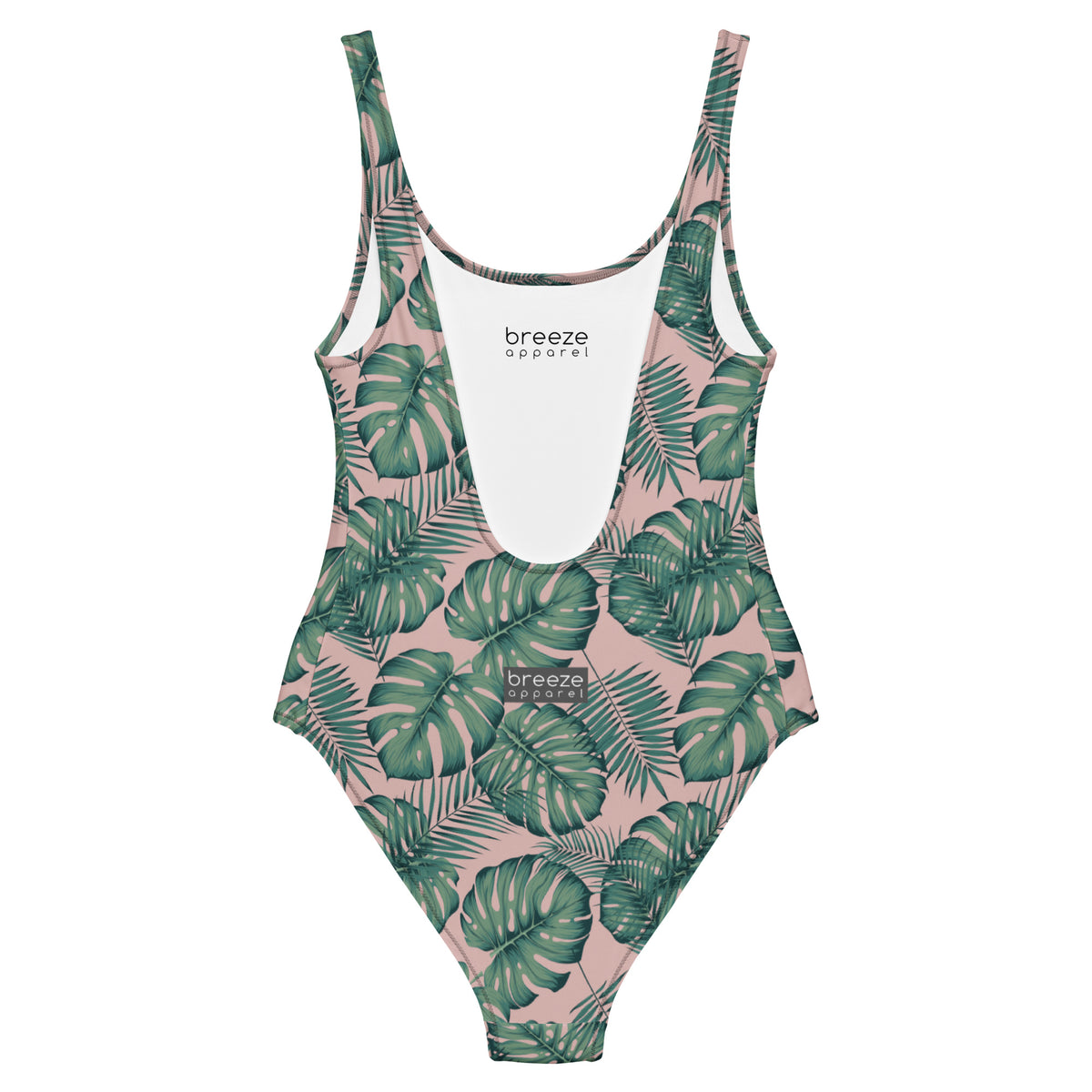Back of one-piece swimsuit with a design of palm leaves set on a pink background.