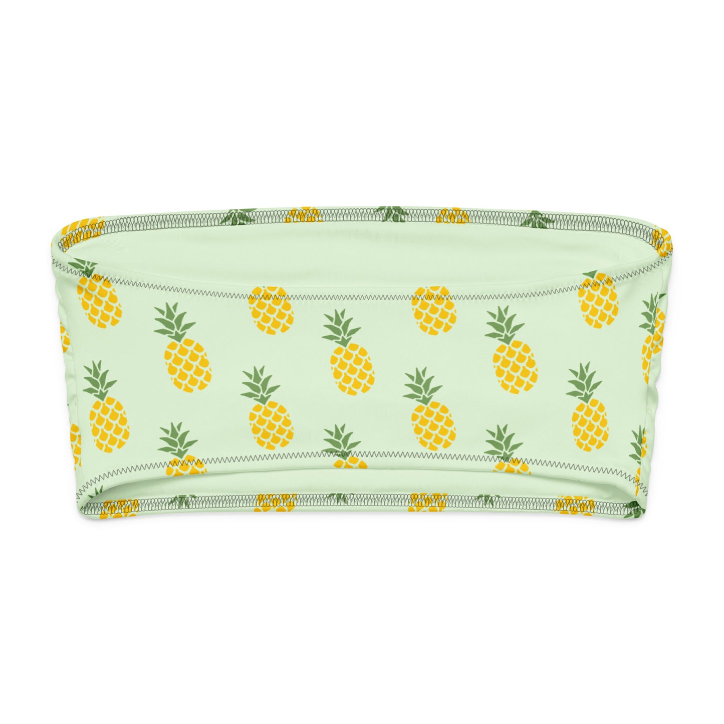 Back of bandeau bikini top with all-over pineapple design, set on a light-green background.
