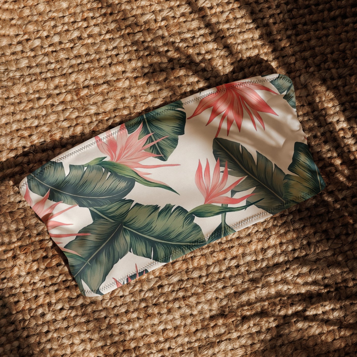 Bandeau bikini top with tropical floral pattern.