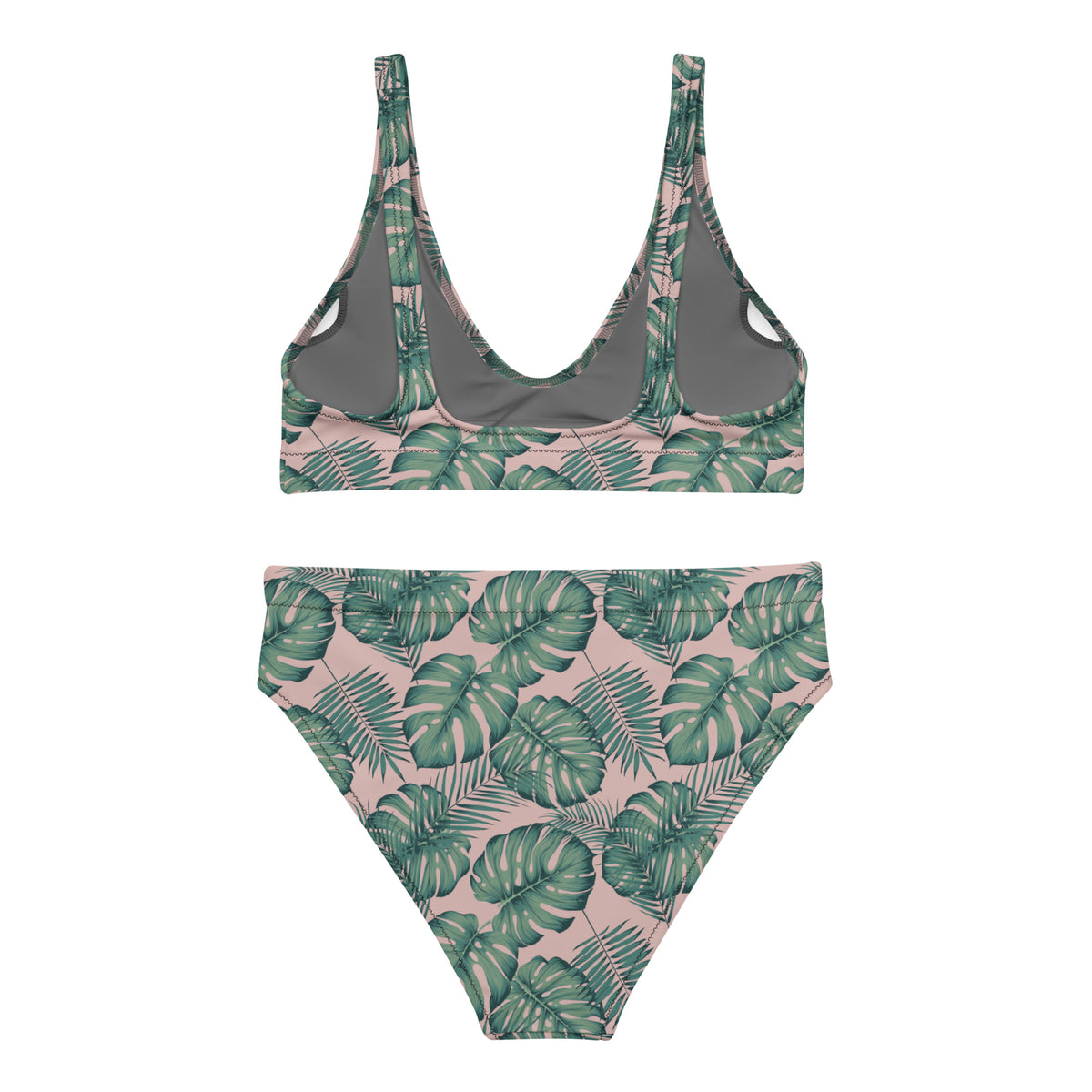 Back of bikini with pattern of green palm leaves set on a pink background.