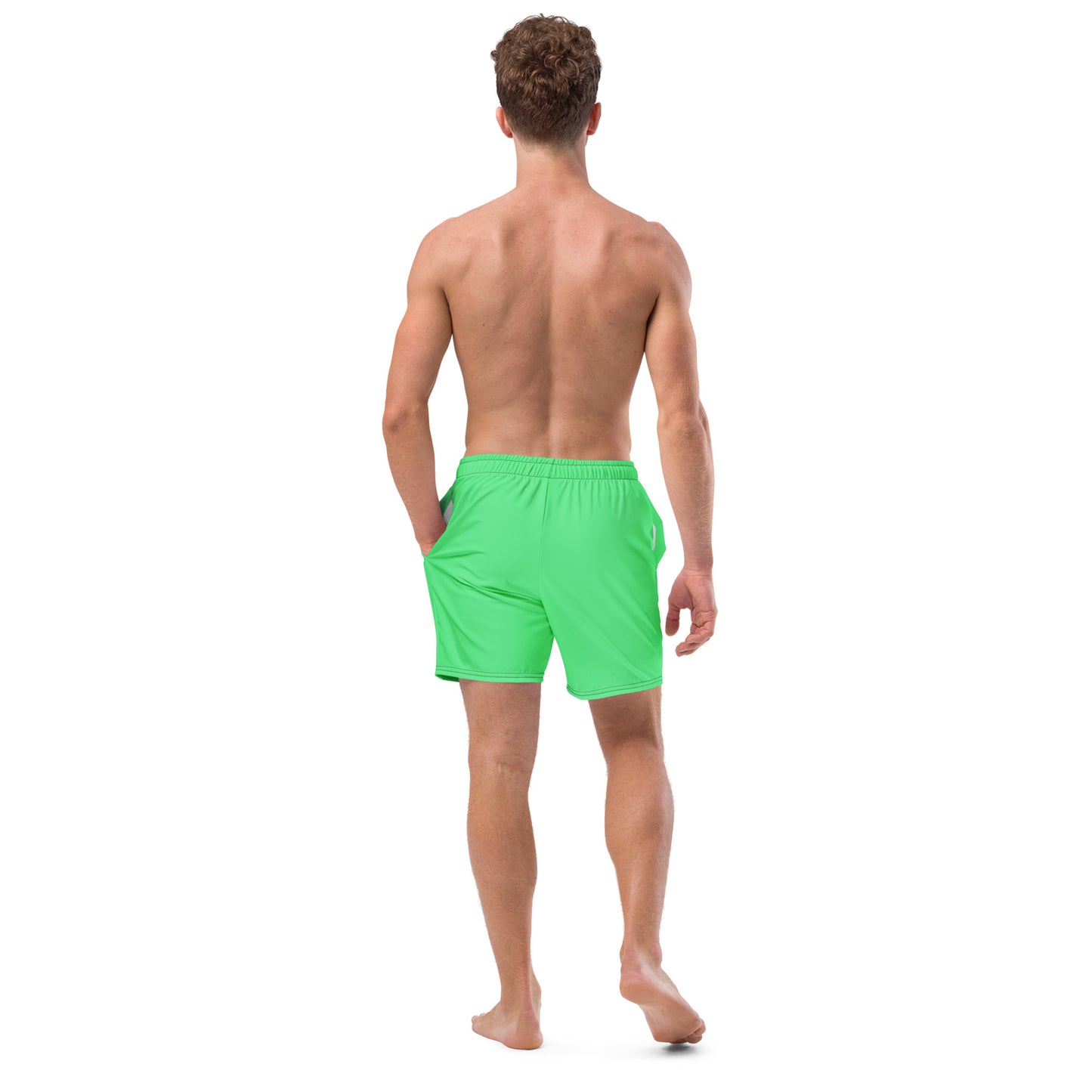 Rear view of man wearing mint-green swim trunks.