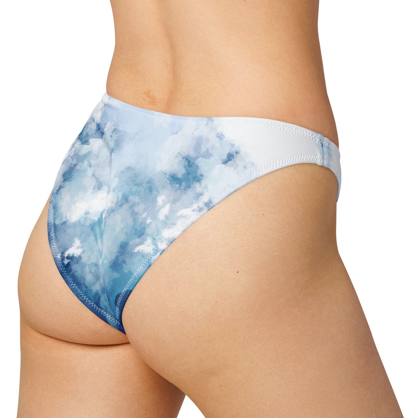 Rear view of woman wearing bikini bottom with a blue-white, watercolor-like design.