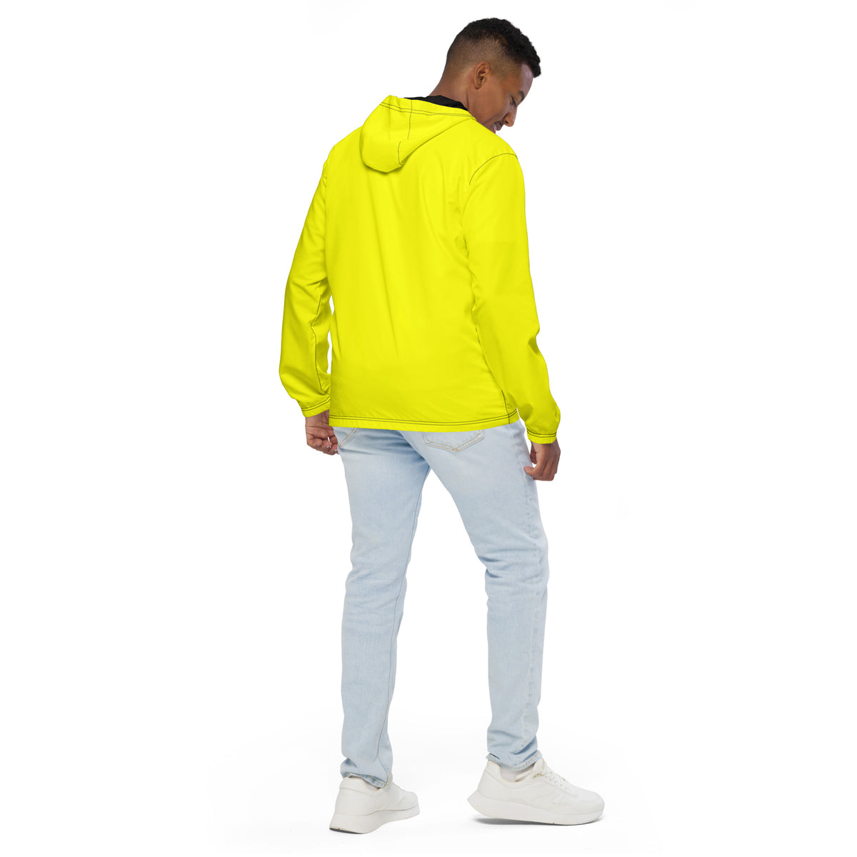 Rear view of man wearing yellow jacket.
