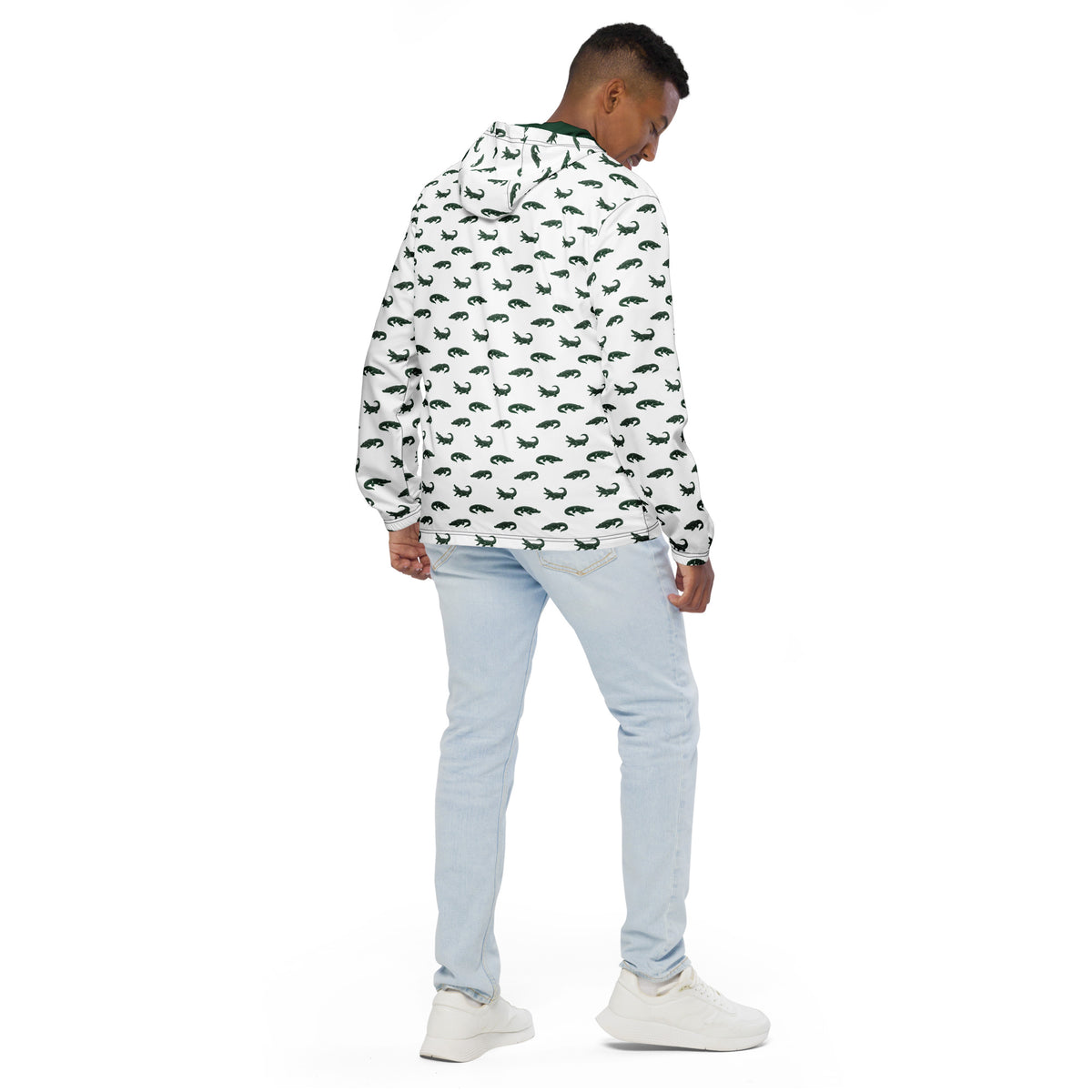 Man wearing white jacket with pattern of green alligators.