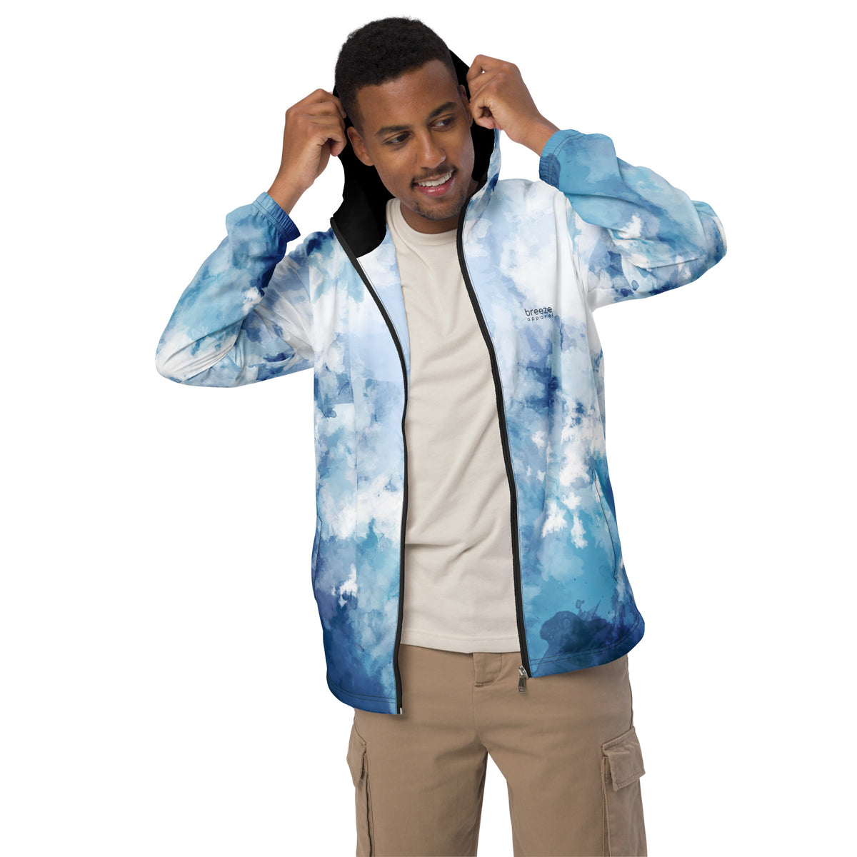 Man wearing jacket with blue-white pattern resembling watercolor.