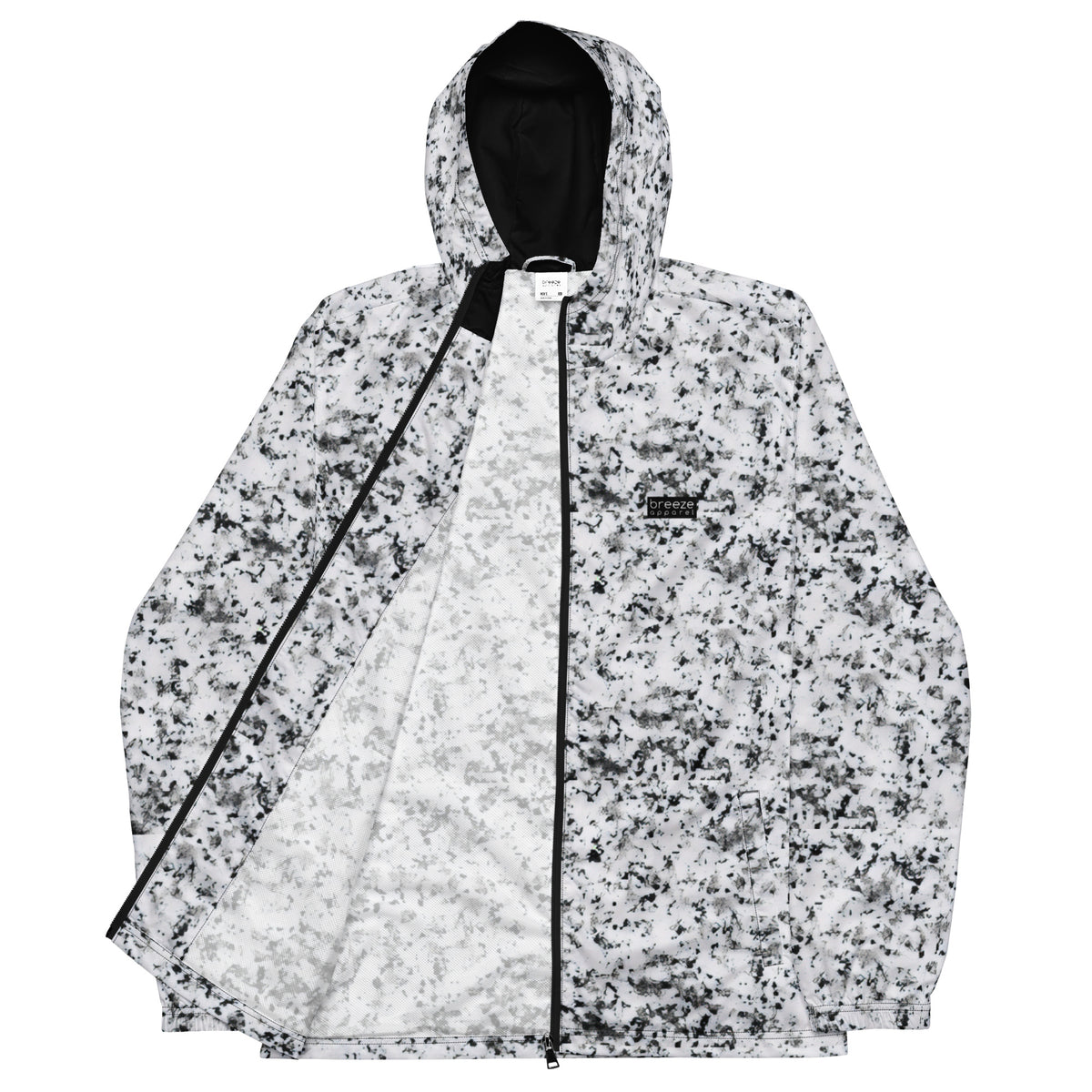 Jacket with pattern of black splotches on a white background.