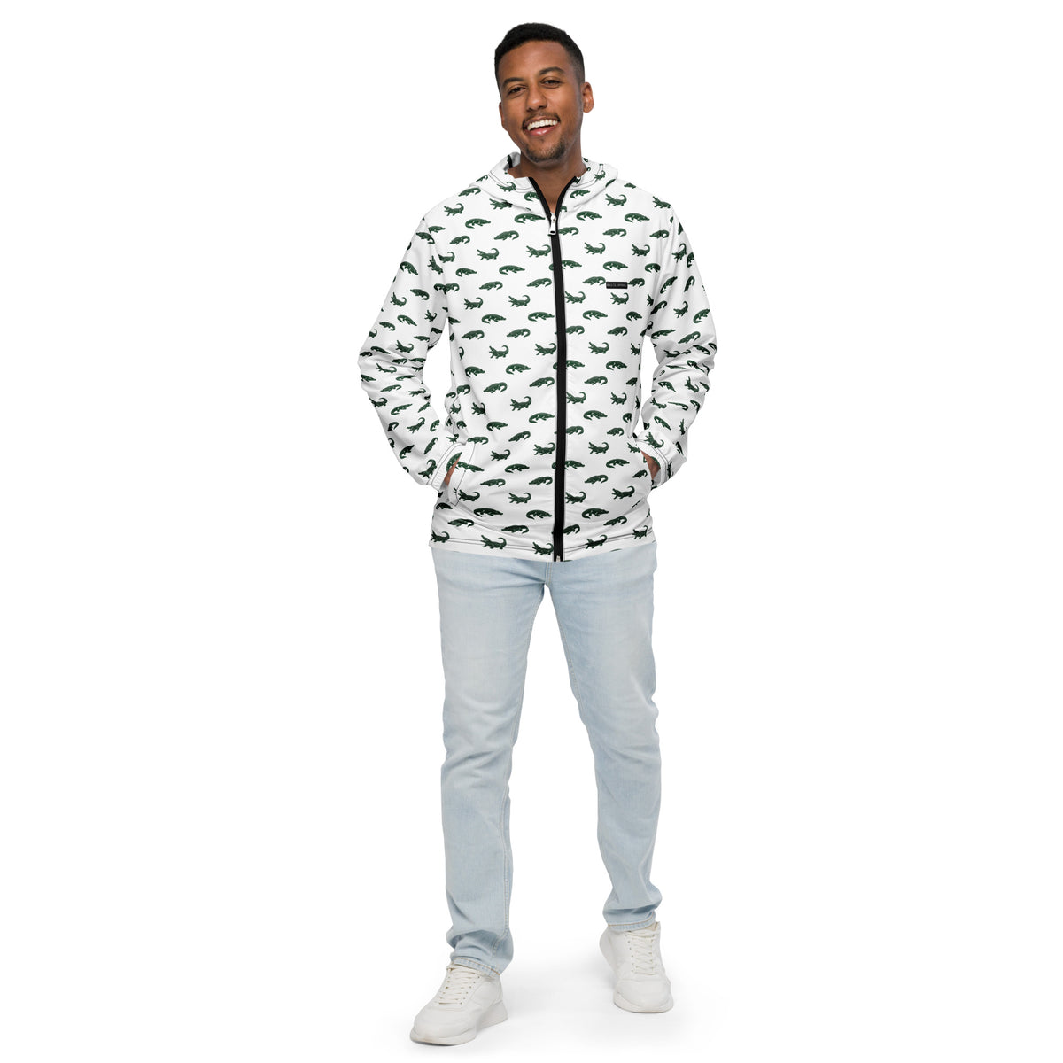 Man wearing white jacket with pattern of green alligators.