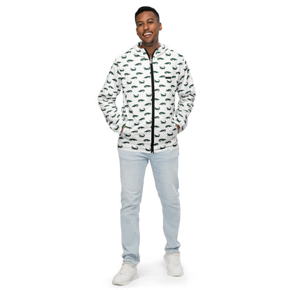 Man wearing white jacket with pattern of green alligators.