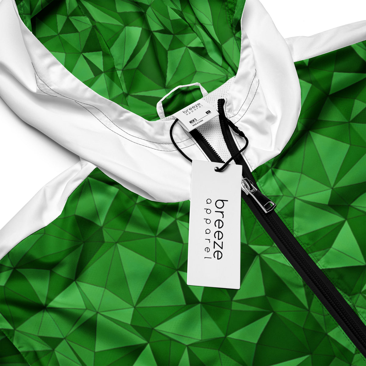 Windbreaker with green geometric pattern.