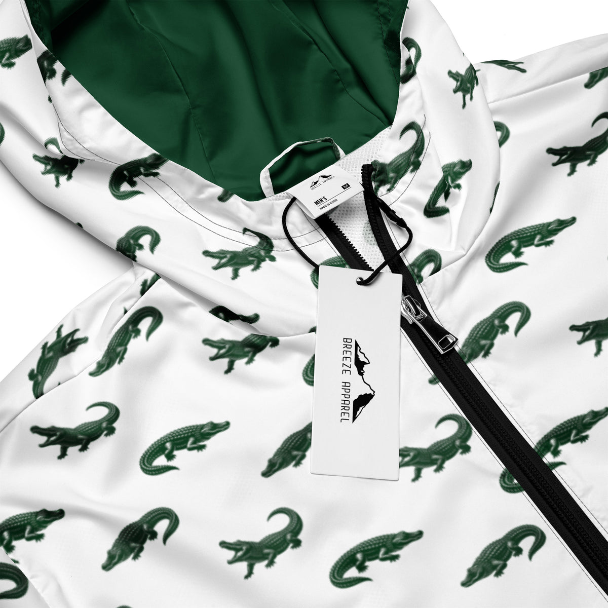 White jacket with pattern of green alligators.