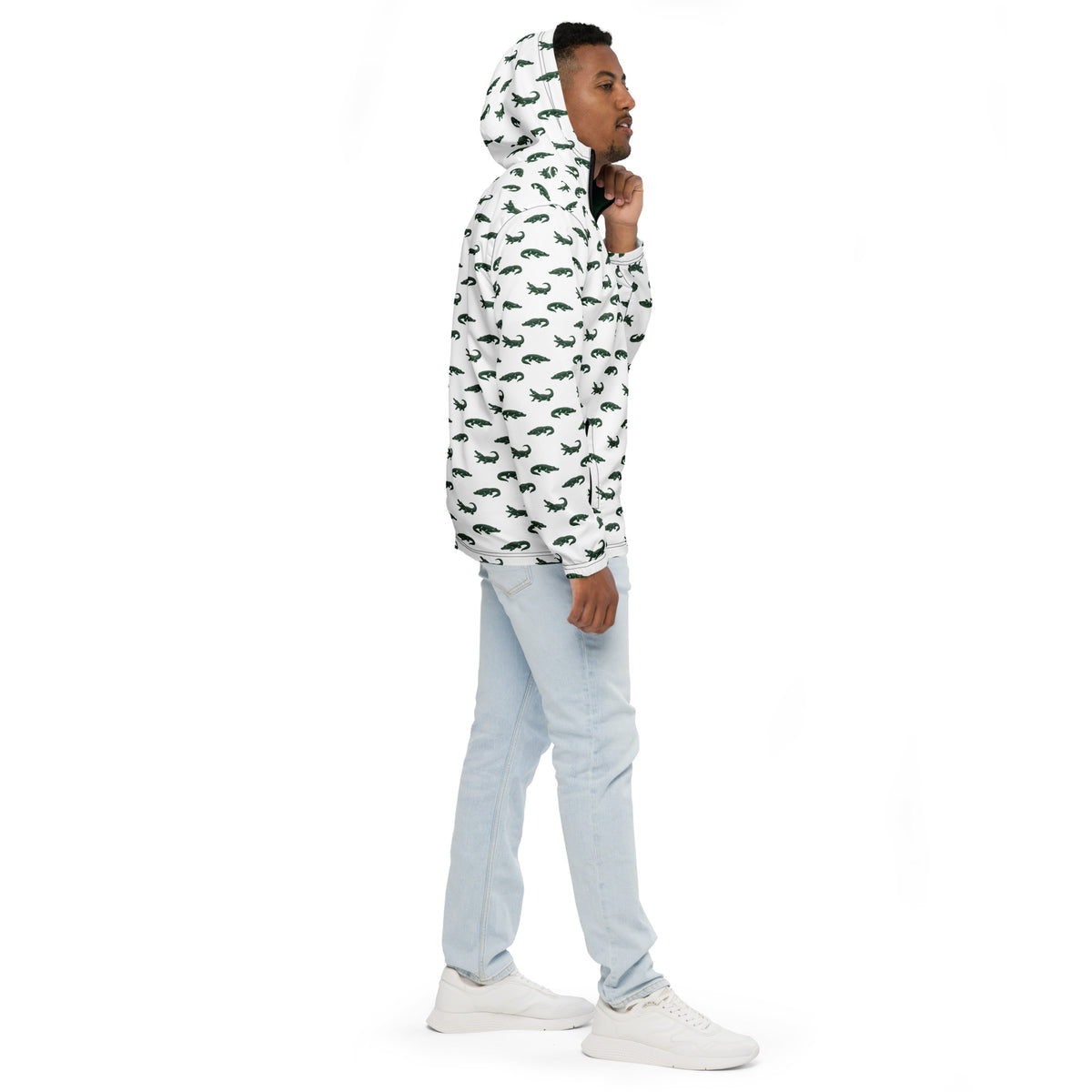 Man wearing white jacket with pattern of green alligators.