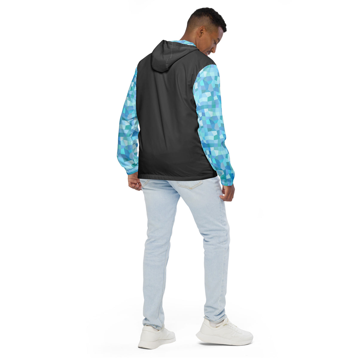Rear view of man wearing jacket with gray back and light-blue geometric pattern on sleeves.