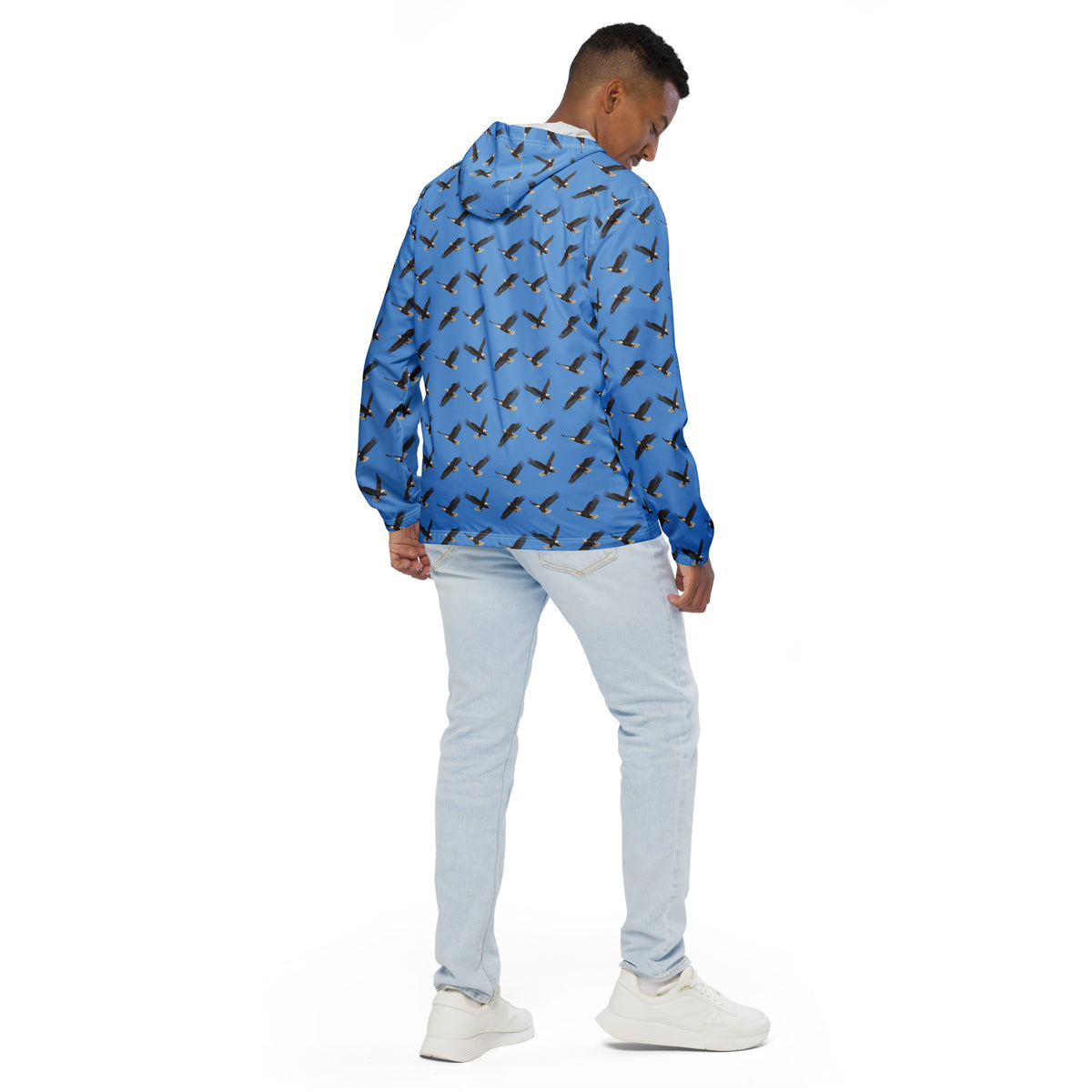 Man wearing blue jacket with pattern of bald eagles.
