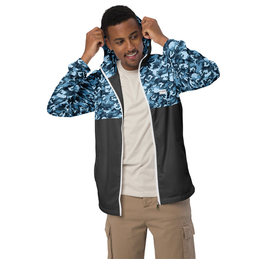 Man wearing jacket with navy camouflage pattern on top, hood interior, and sleeves; rest is gray.