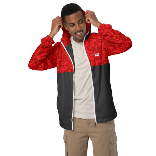 Man wearing windbreaker with red geometric pattern on top half, hood interior, and sleeves; rest is gray.