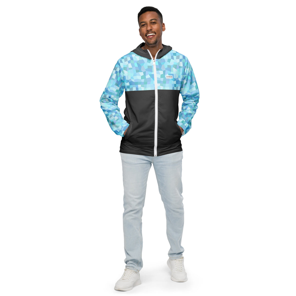 Man wearing jacket with light-blue geometric pattern on hood interior, top, and sleeves; rest is gray.