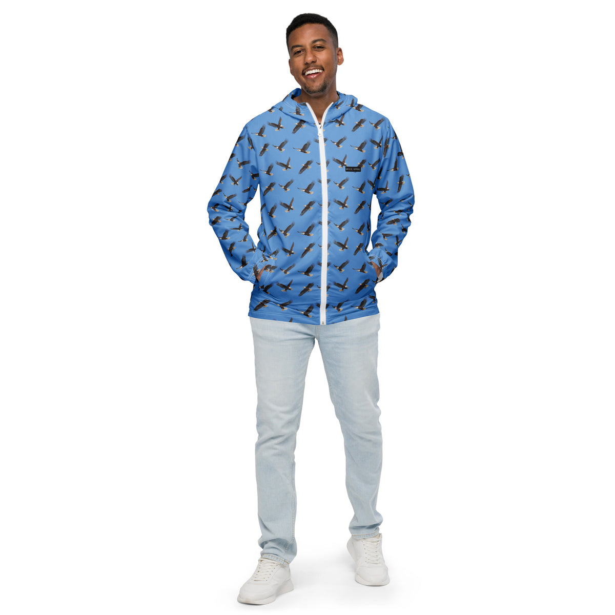 Man wearing blue jacket with pattern of bald eagles.
