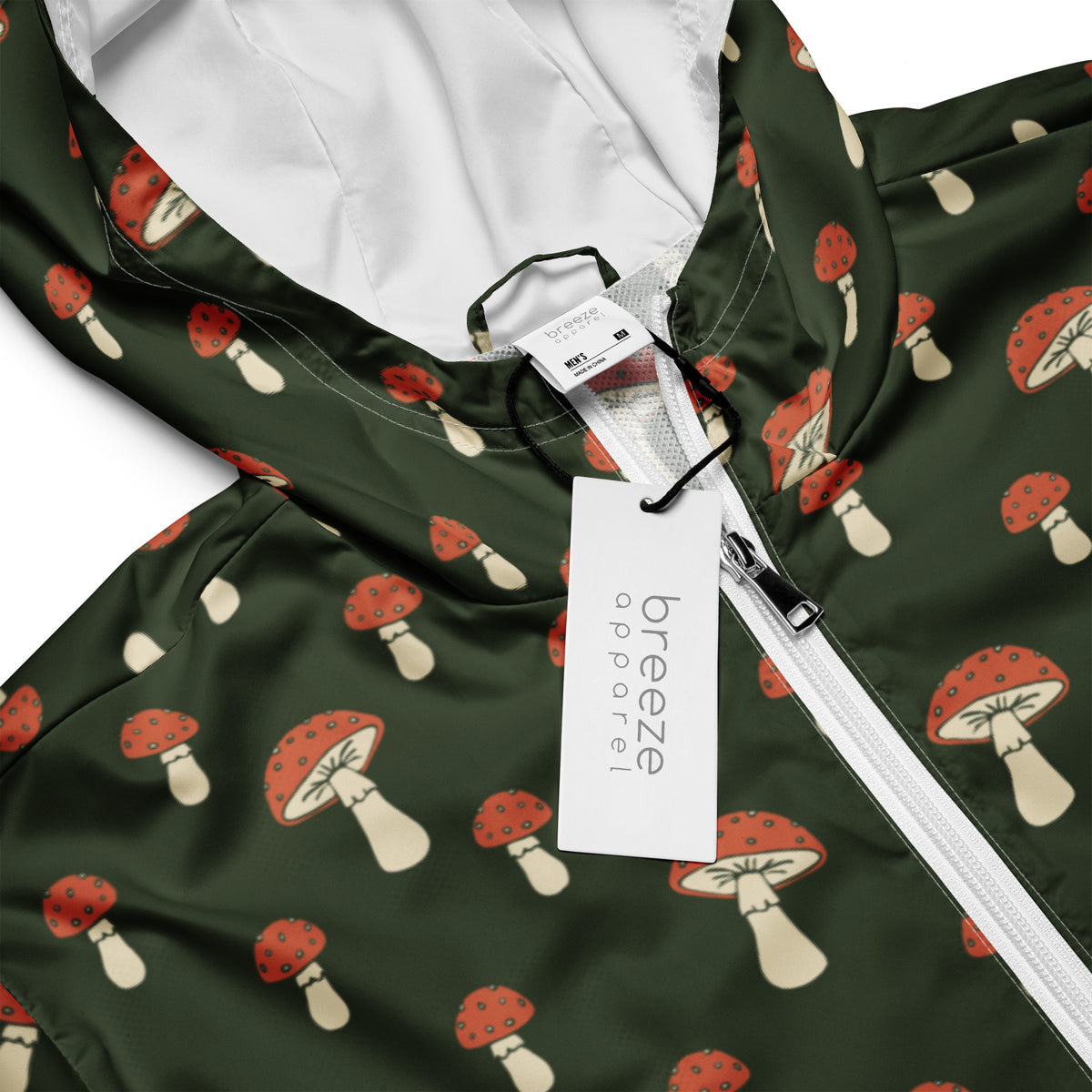 Jacket with pattern of mushrooms set on a green background.