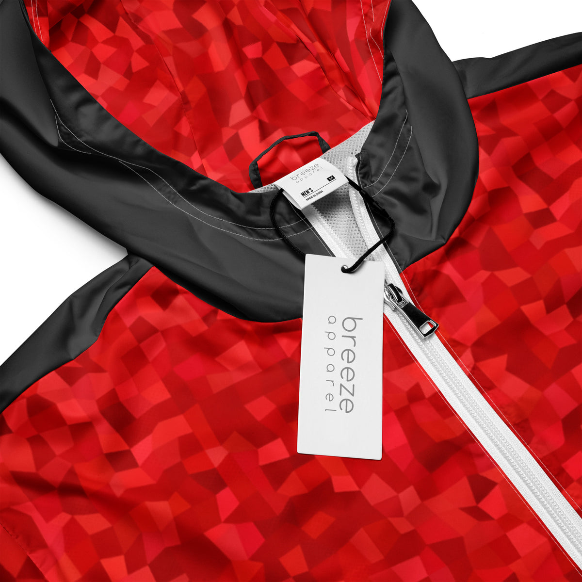 Windbreaker with red geometric pattern.