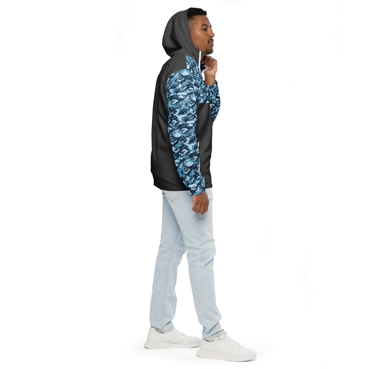 Man wearing jacket with navy camouflage pattern on top, hood interior, and sleeves; rest is gray.