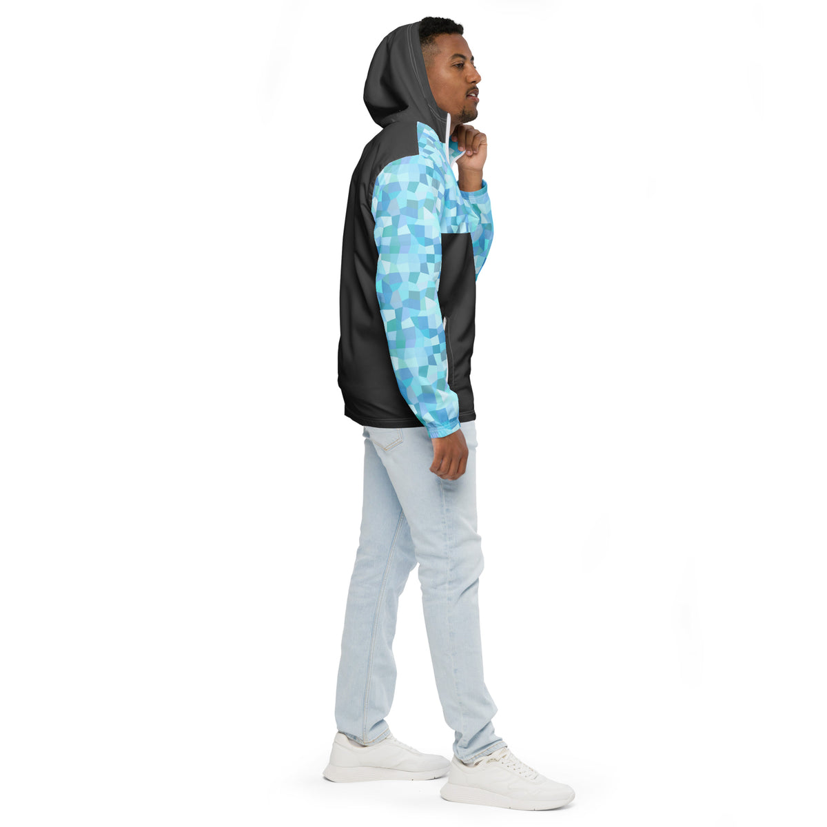 Man wearing jacket with light-blue geometric pattern on hood interior, top, and sleeves; rest is gray.