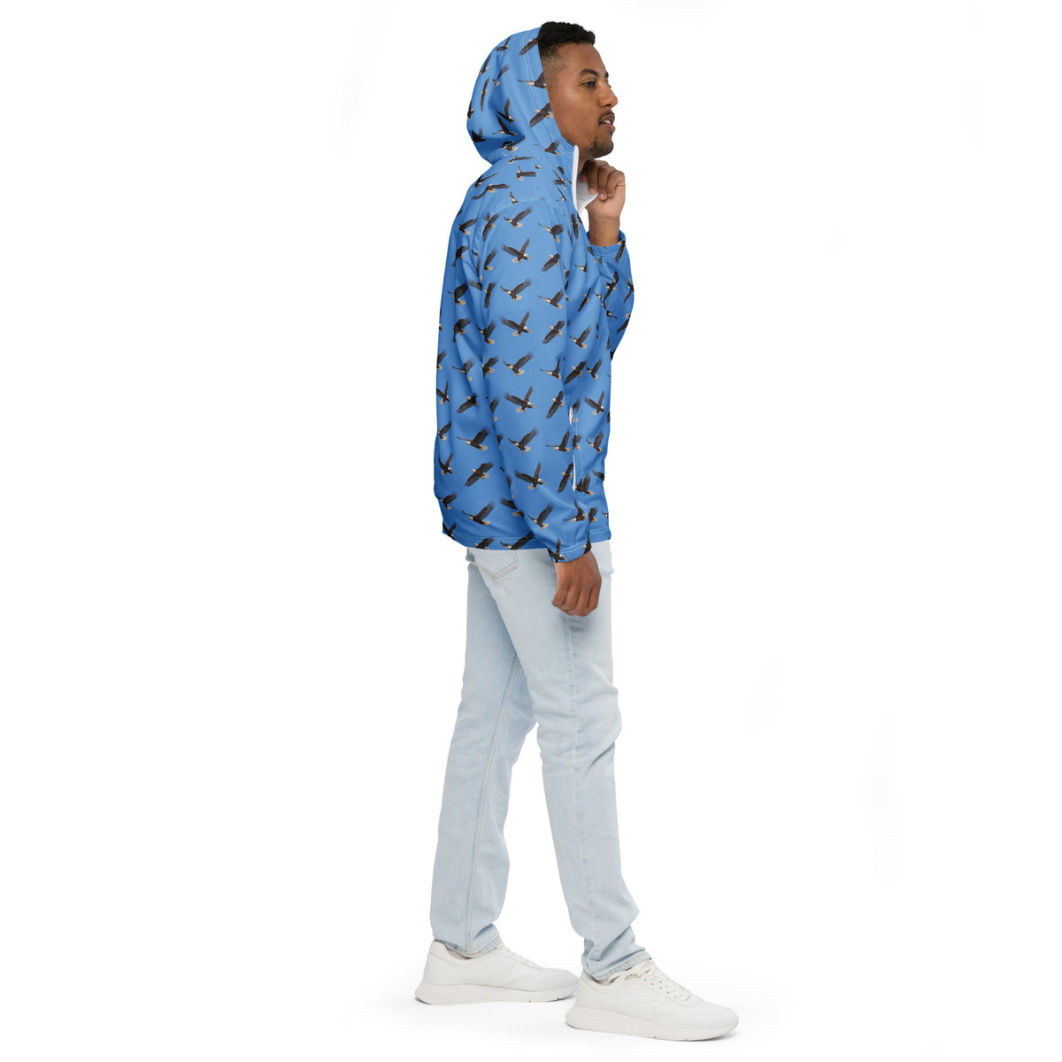 Man wearing blue jacket with pattern of bald eagles.