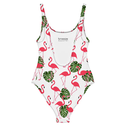 Back of white, one-piece swimsuit with a pattern consisting of flamingos and palm leaves. 