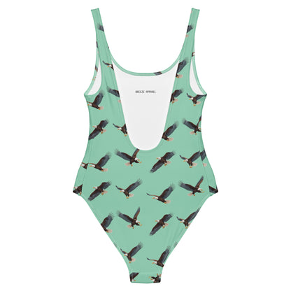 Green one-piece swimsuit with pattern of bald eagles.