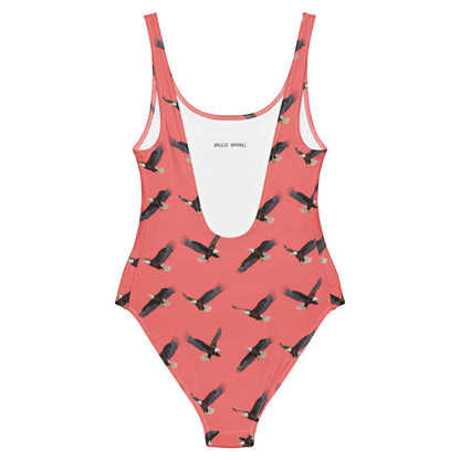 Red one-piece swimsuit with pattern of bald eagles.