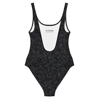 One-piece swimsuit with black geometric pattern.