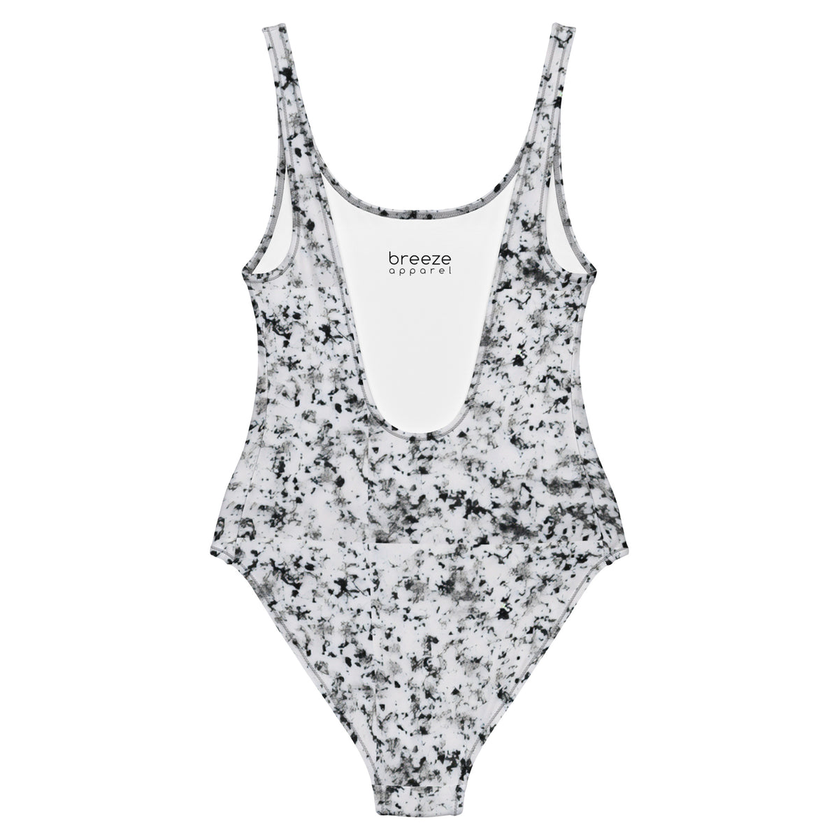 One-piece swimsuit with pattern of black splotches set on a white background.