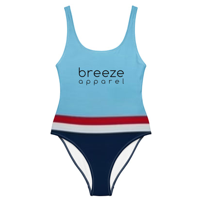 One-piece swimsuit with light-blue top, followed by a red stripe, then a white stripe, followed by a navy-blue bottom part.