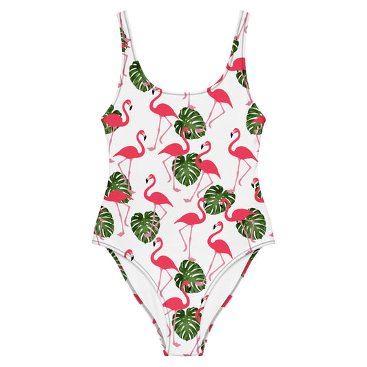 White, one-piece swimsuit with a pattern consisting of flamingos and palm leaves. 
