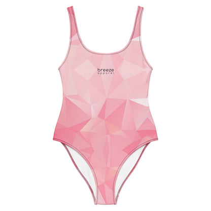 One-piece swimsuit with all-over, pink geometric pattern. 'Breeze apparel' is in small, black text on chest.