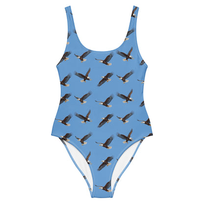 Blue one-piece swimsuit with pattern of bald eagles.