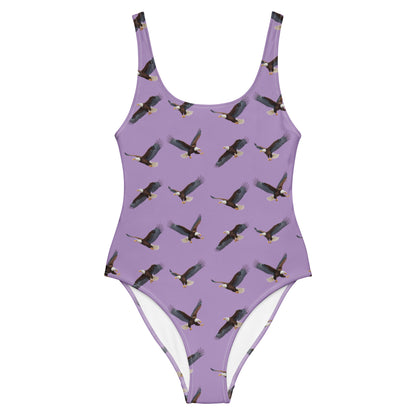 Purple one-piece swimsuit with pattern of bald eagles.