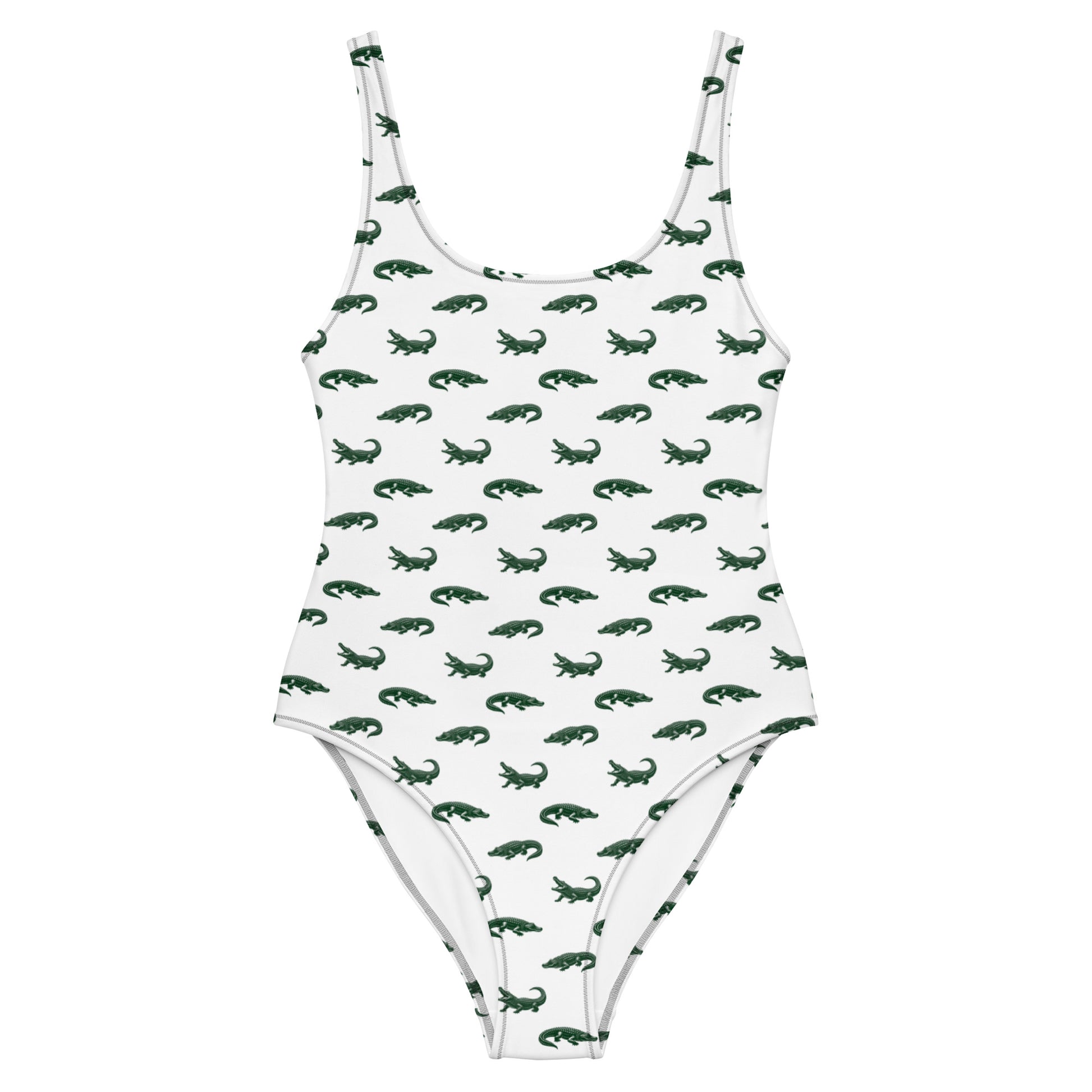 White one-piece swimsuit with pattern of green alligators.