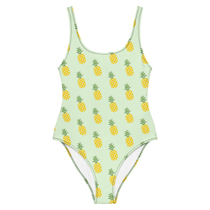 Light-green, one-piece swimsuit with pattern of pineapples.