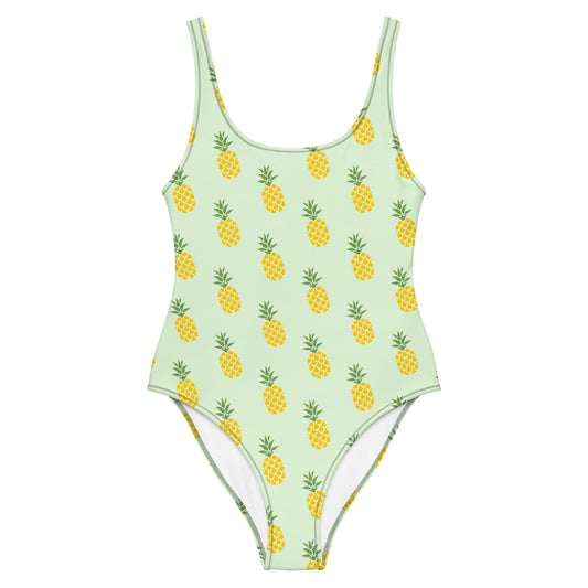Light-green, one-piece swimsuit with pattern of pineapples.