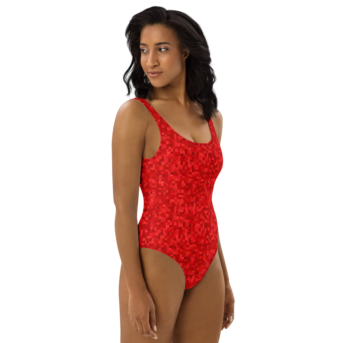 Woman wearing one-piece swimsuit with an all-over, red geometric pattern.