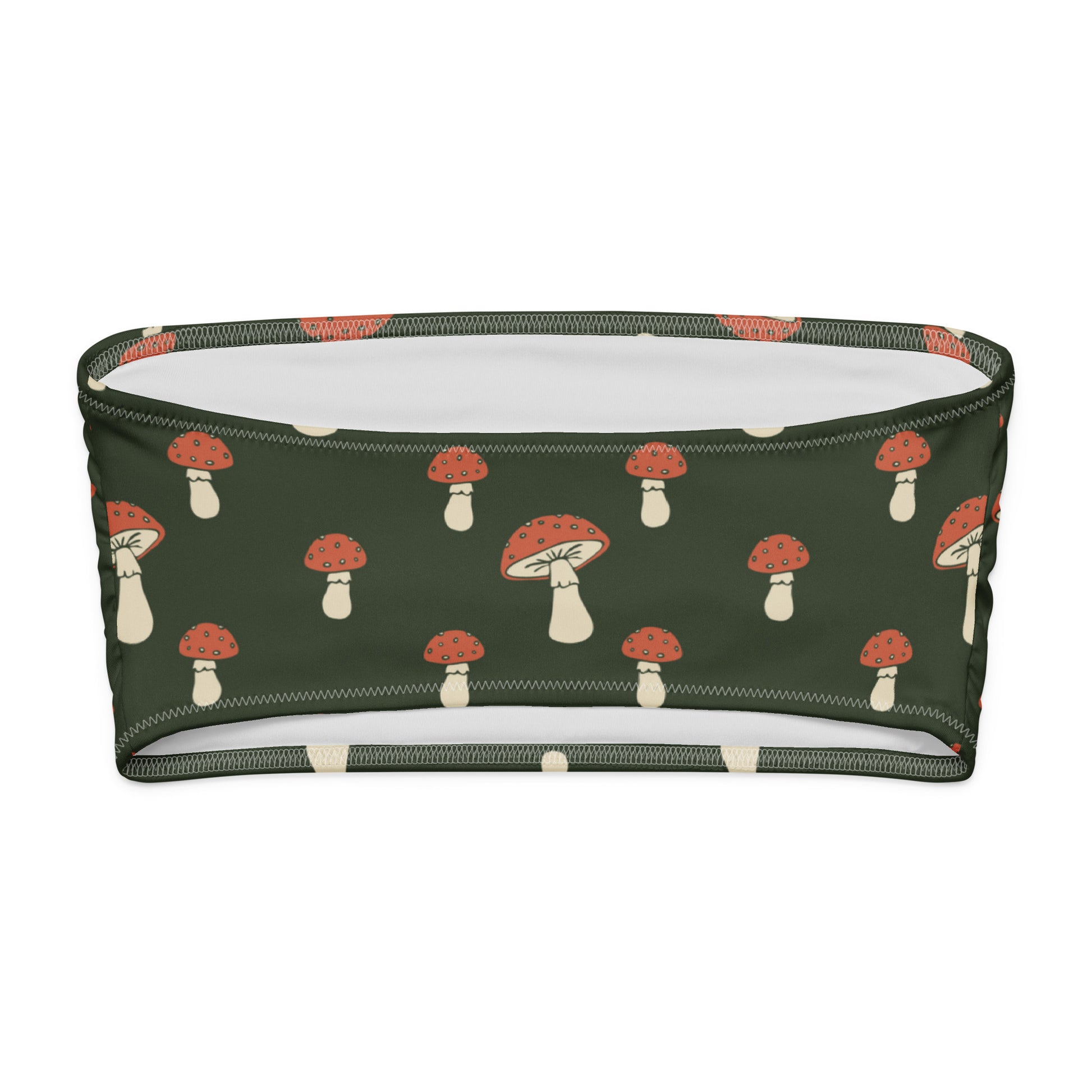 Back of bandeau bikini top with all-over design of mushrooms set on a dark-green background.