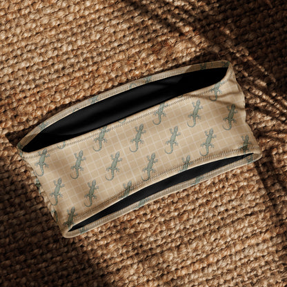 Beige bikini top with pattern of green geckos.