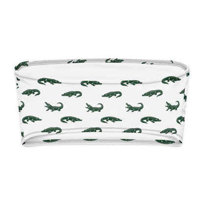 White bikini top with pattern of green alligators.