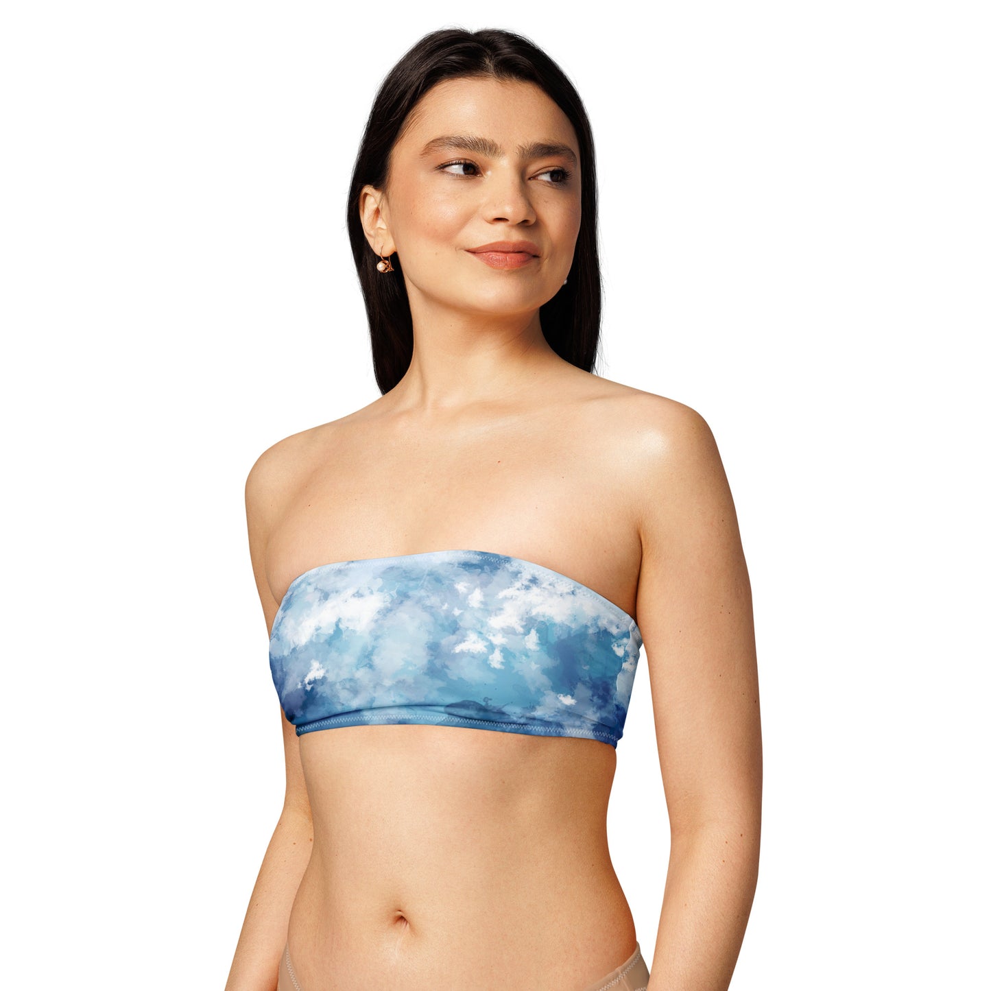Woman wearing bandeau bikini top with a blue-white, watercolor-like design.