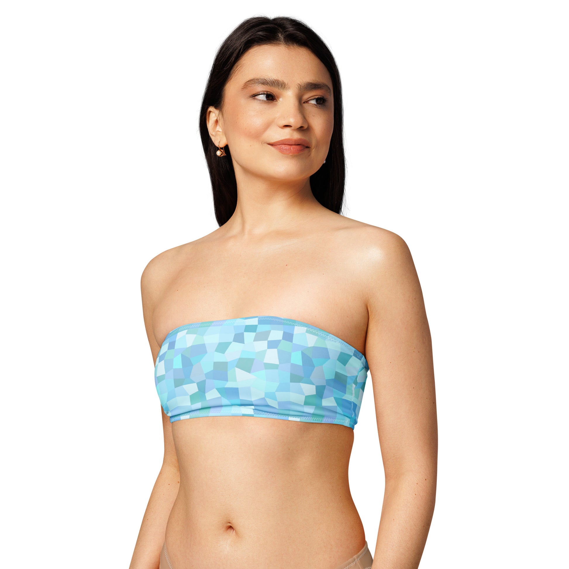 Woman wearing bandeau bikini top with cyan geometric pattern.