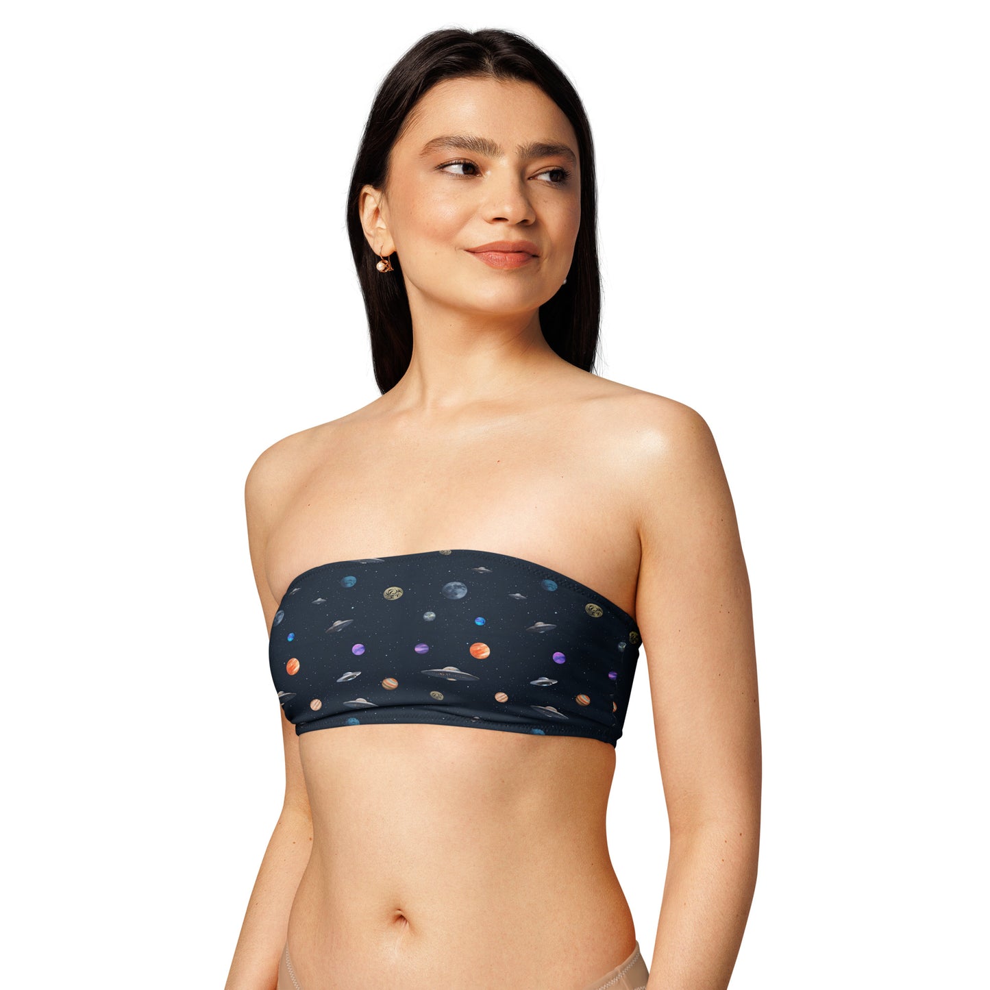 Woman wearing bikini top with pattern of UFOs and planets in space.