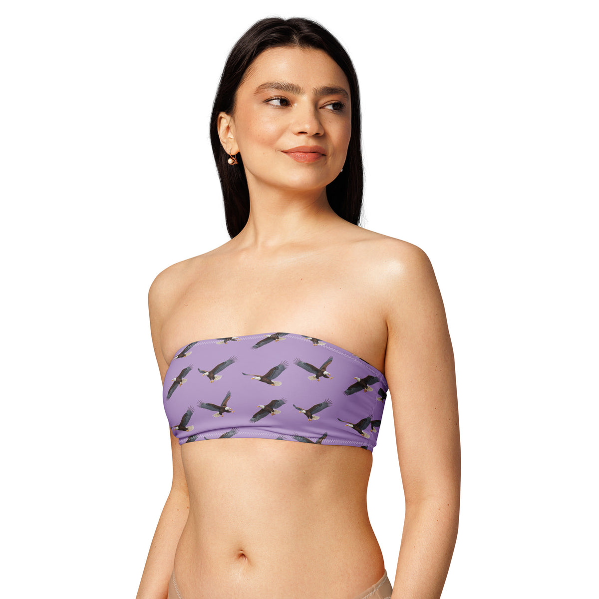 Woman wearing purple bandeau bikini top with pattern of bald eagles.