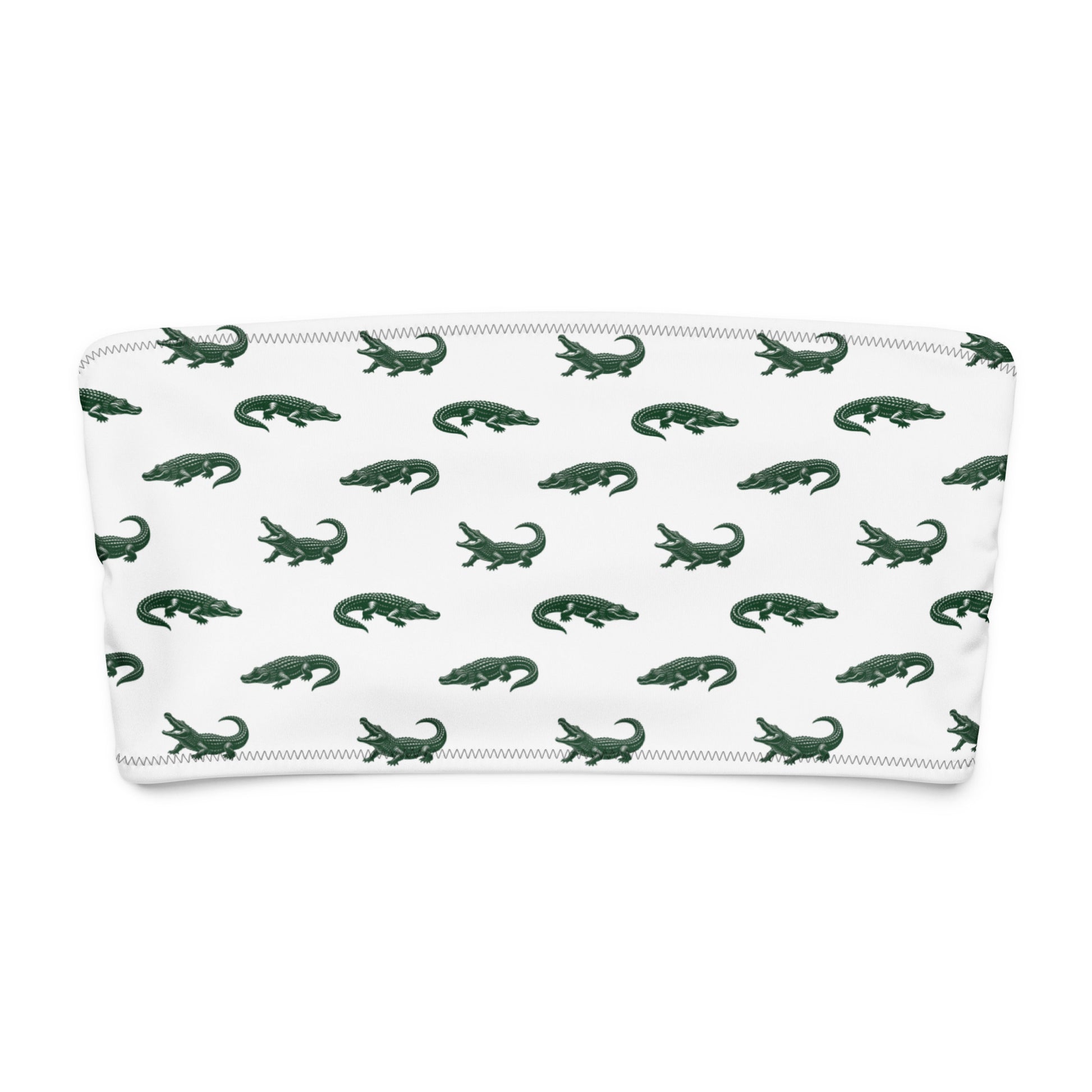 White bikini top with pattern of green alligators.