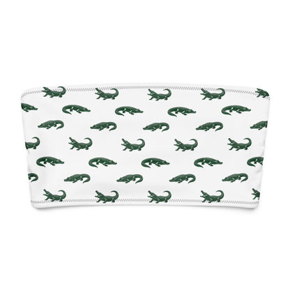 White bikini top with pattern of green alligators.