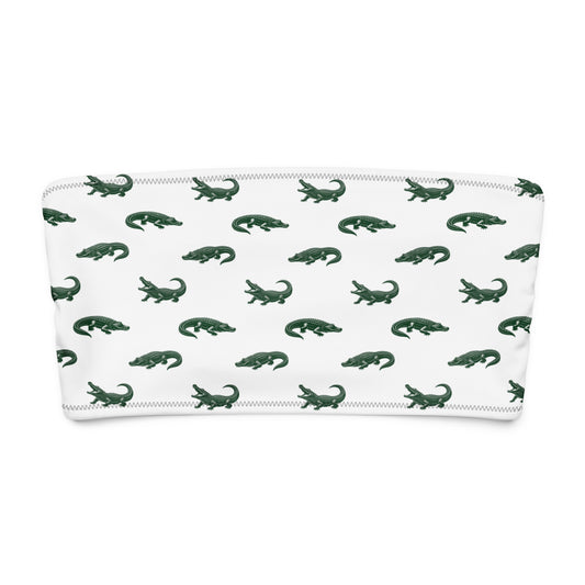 White bikini top with pattern of green alligators.